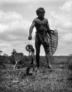 Charlie Murray with killed snake near Port Macquarie (note house and Lake Road in background).