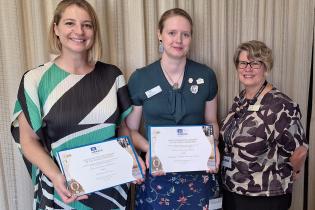 Sophie Netchaef (Powerhouse Museum) and Abbey Turrell and Kathryn Dan (ANU Archives) with the certificates of inscription for the Tooth and Company Collection.